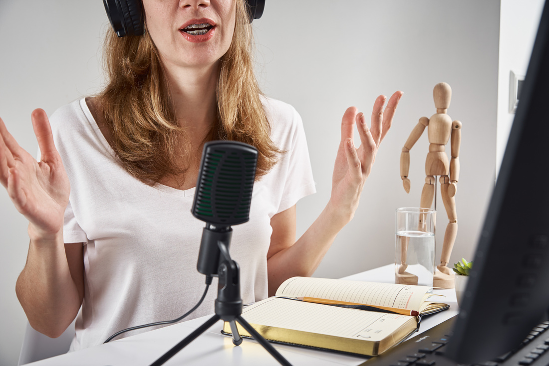 Woman records online podcast at home, podcasting concept